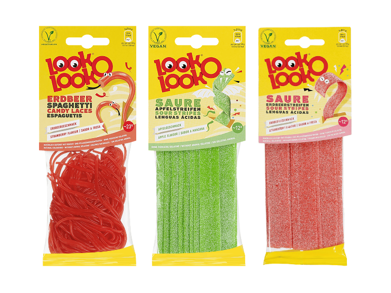 Drei Packungen verschiedener Fruchtgummis in gelber Verpackung.