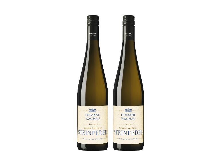 Zwei Flaschen Weißwein auf schwarzem Hintergrund.