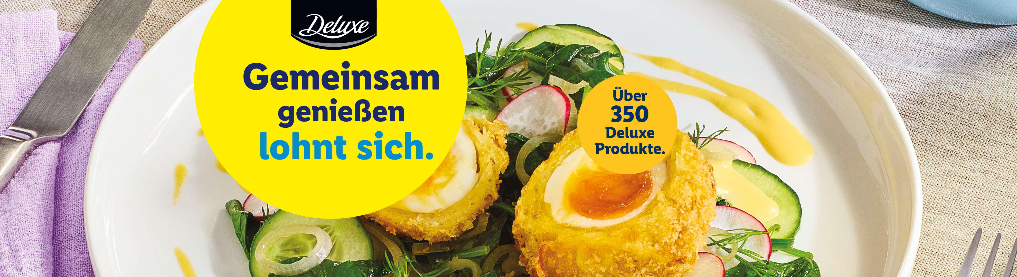 Scotch Eggs mit Salat und Soße, dazu der Text: 'Gemeinsam genießen lohnt sich. Über 350 Deluxe Produkte.'