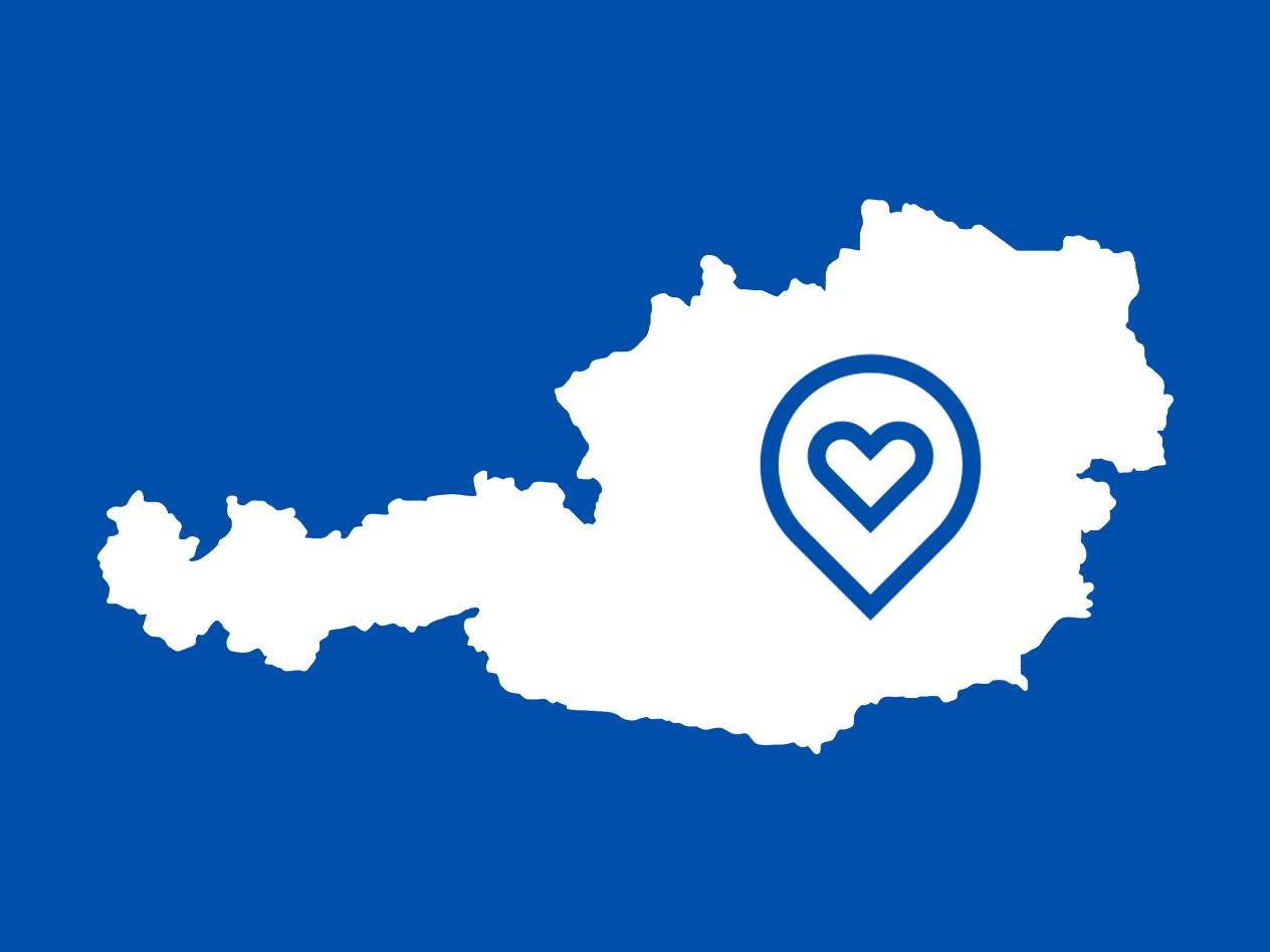 Umrisskarte von Österreich mit einem Herz-Standortsymbol.
