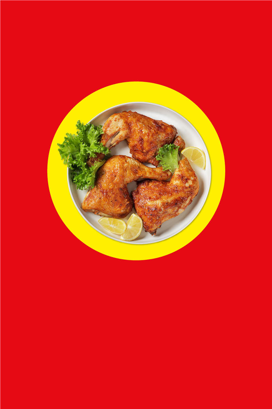 Gebratenes Hähnchen mit Salat und Zitrone auf einem Teller mit rotem Hintergrund.