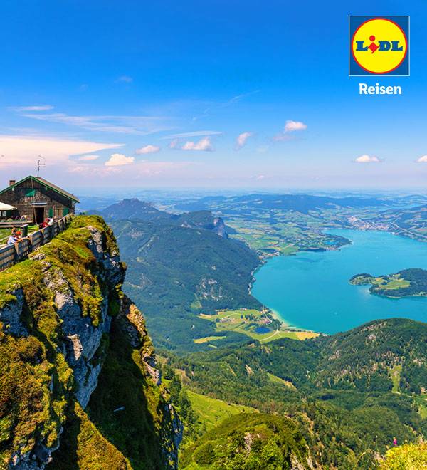 LIDL Reisen zeigt eine atemberaubende Berglandschaft mit See.