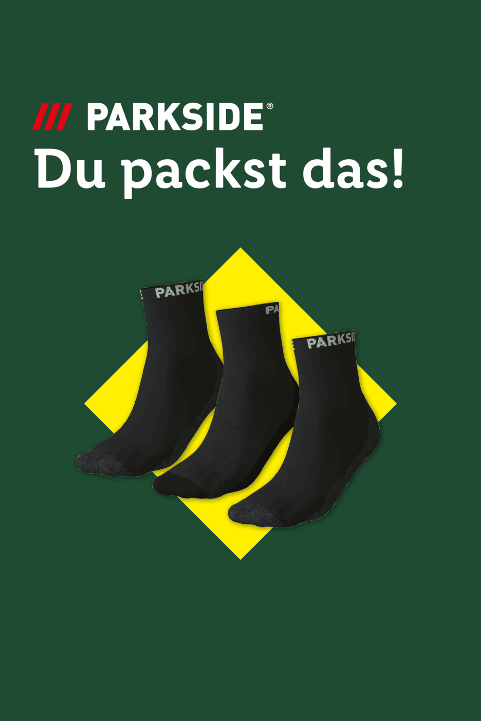 Drei schwarze Socken auf gelbem Hintergrund mit dem Text 'Du packst das!'