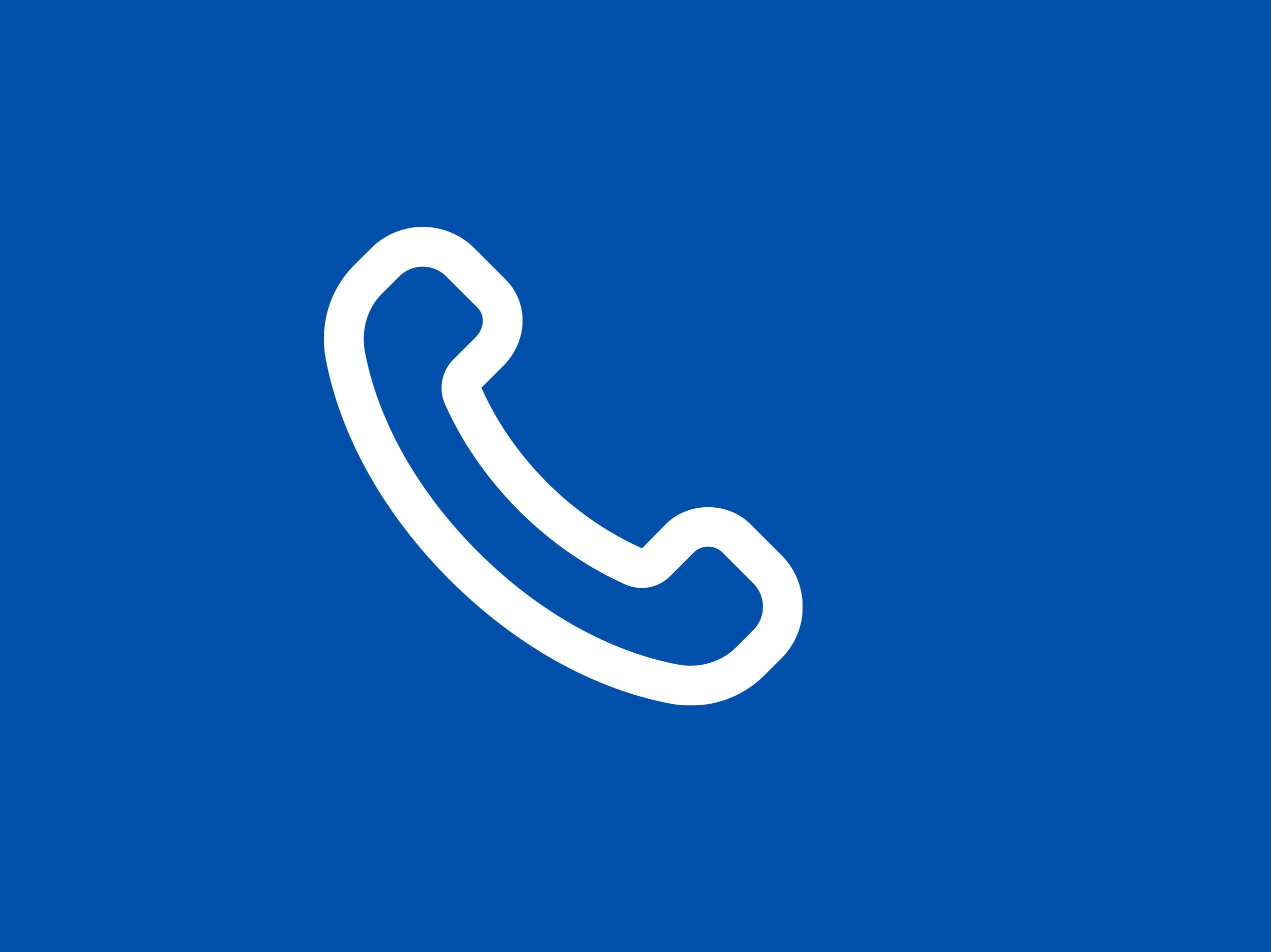 Ein weißes Telefonsymbol auf blauem Hintergrund.